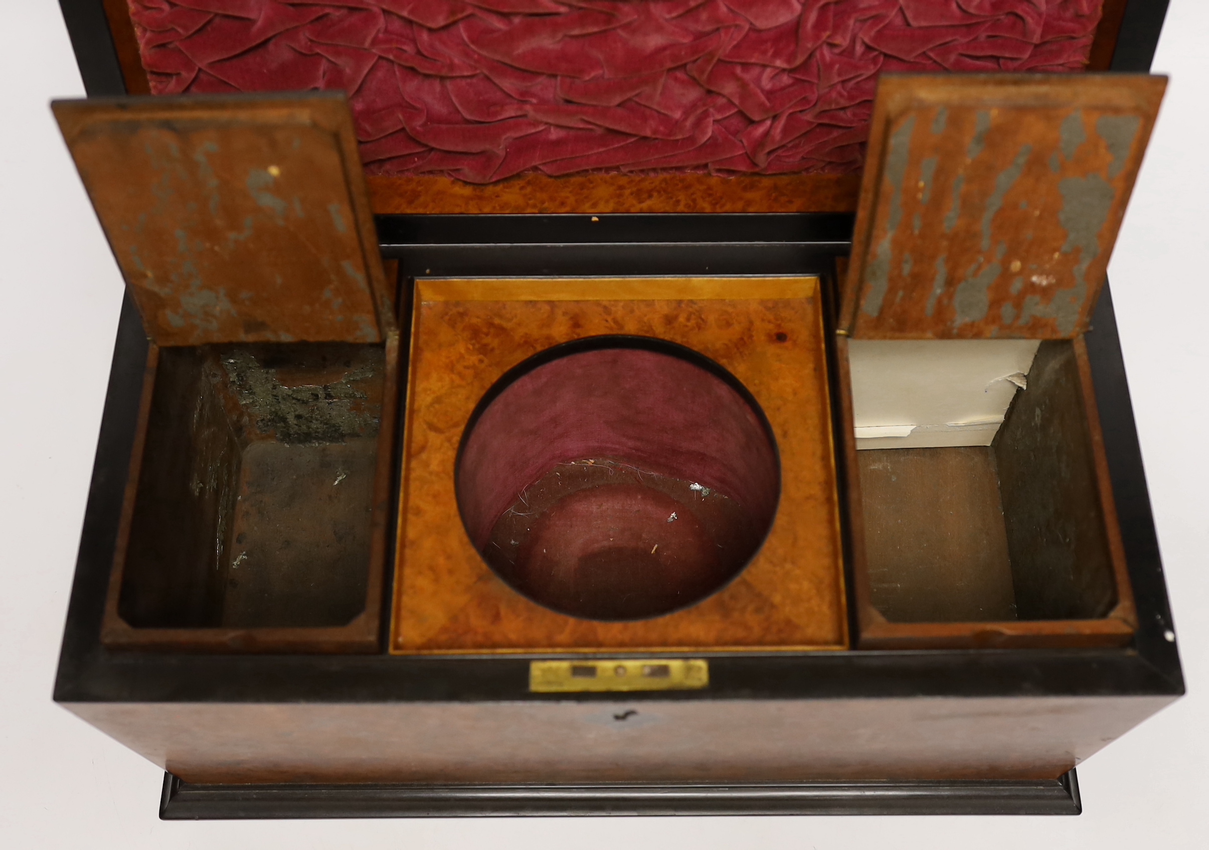 A George IV amboyna and ebony banded sarcophagus shaped tea caddy, with pedestal glass bowl, 35.5cm wide